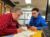 Tax Help Colorado volunteer Judy Keating helps MCC student Adrian Saldana prepare his 2022 tax return.