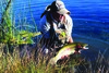 A big fish is what excites a flyfisherman. Here is John who netted a nice 20-inch rainbow.